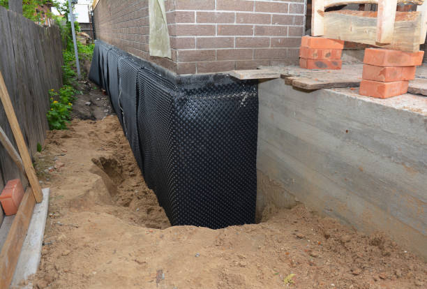 Happy homeowners after waterproofing job in Mount Tabor